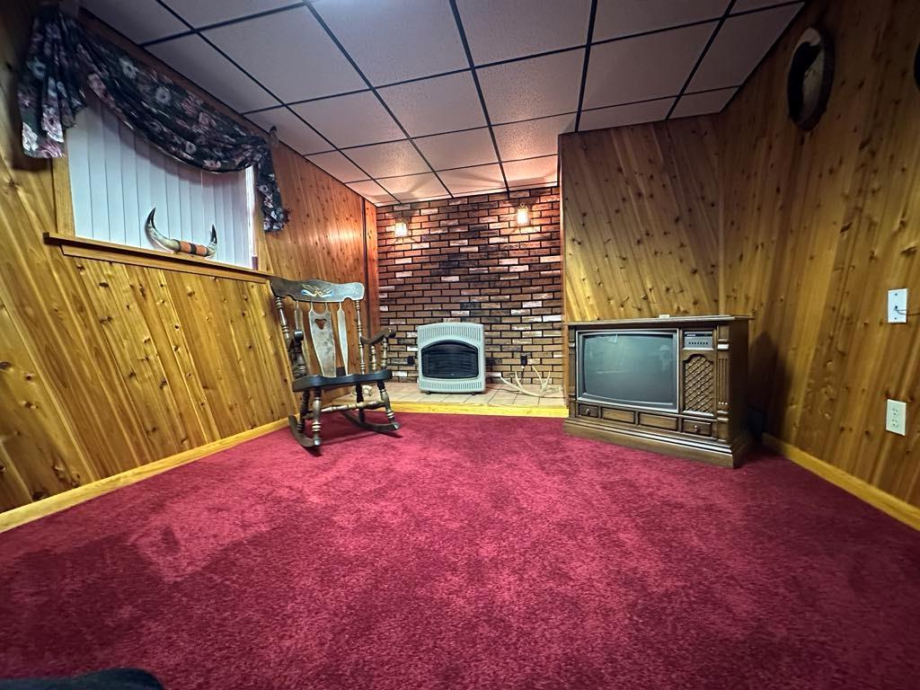 861 Chicora Road Chicora, PA 16025 - Photo 17 of 30 a view of empty room with fireplace and fan