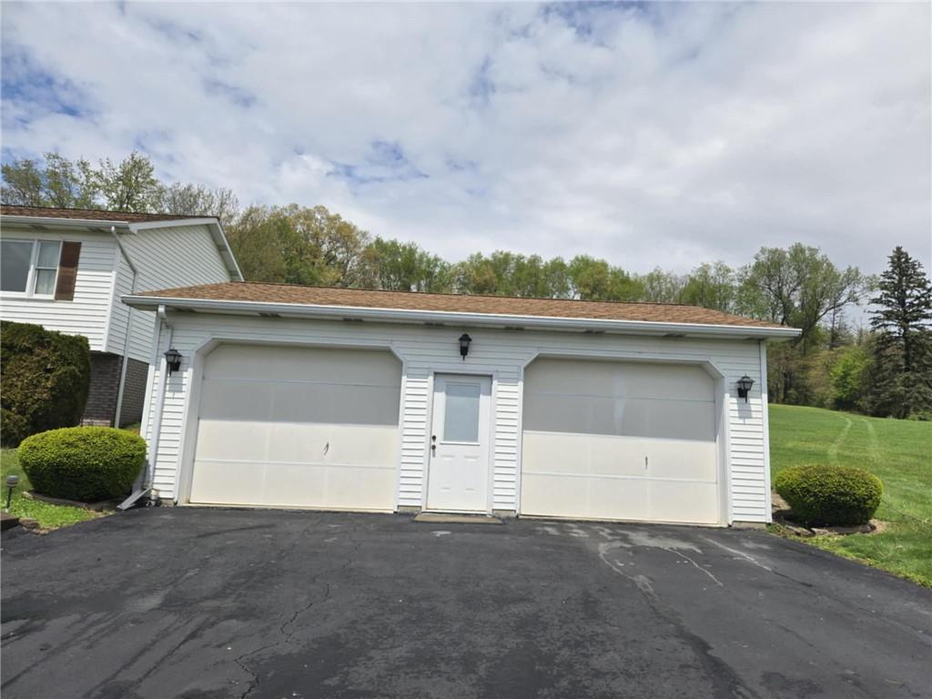 861 Chicora Road Chicora, PA 16025 - Photo 2 of 30 front view of a house with a garage