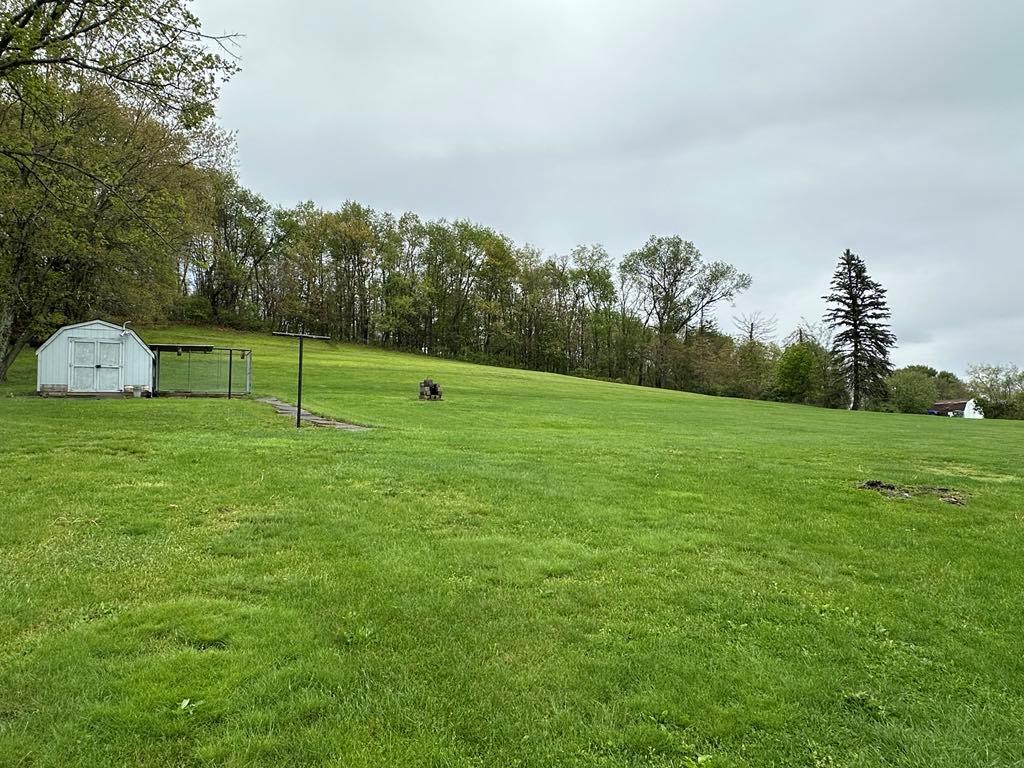 861 Chicora Road Chicora, PA 16025 - Photo 25 of 30 a view of a golf course with a lake