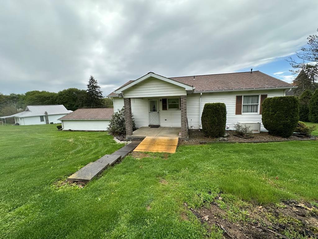 861 Chicora Road Chicora, PA 16025 - Photo 29 of 30 a front view of house with yard and outdoor seating