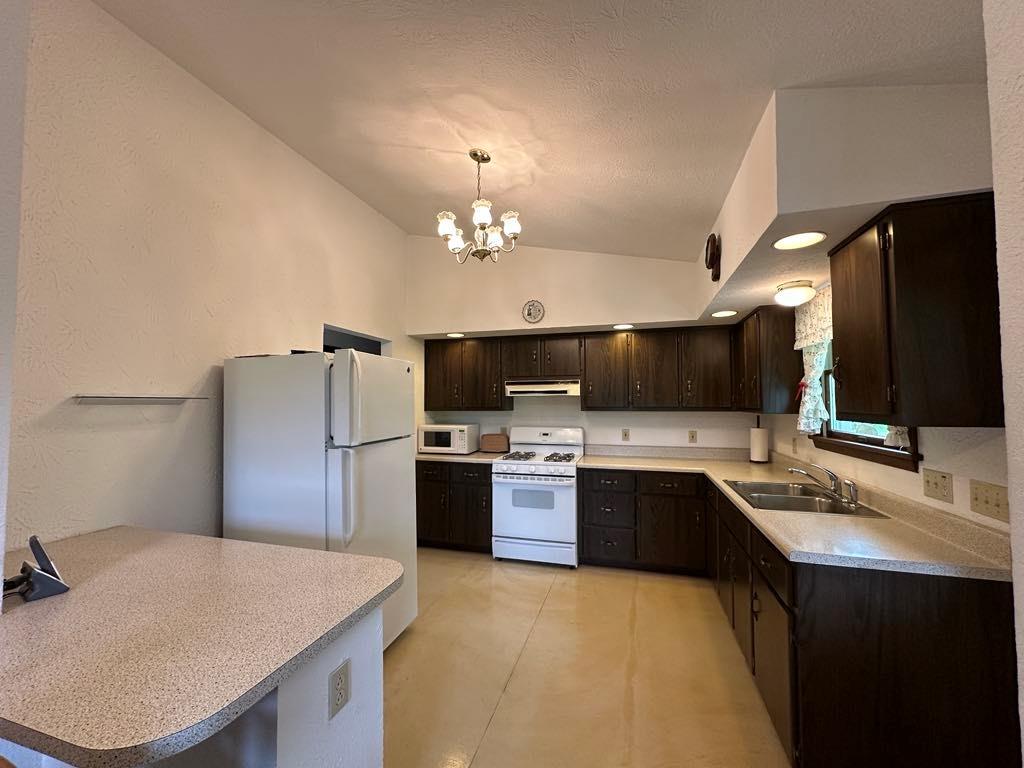 861 Chicora Road Chicora, PA 16025 - Photo 5 of 30 a large kitchen with cabinets and stainless steel appliances