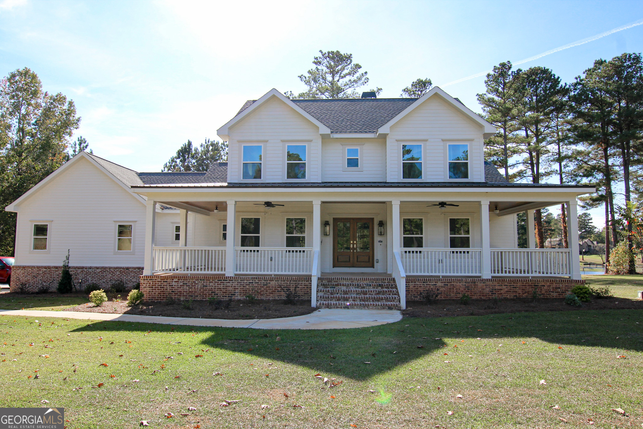 1010 Rock Road Perry, GA 31069 - Photo 1 of 58 a front view of a house with a yard
