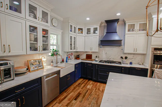 a kitchen with a sink stove and cabinets