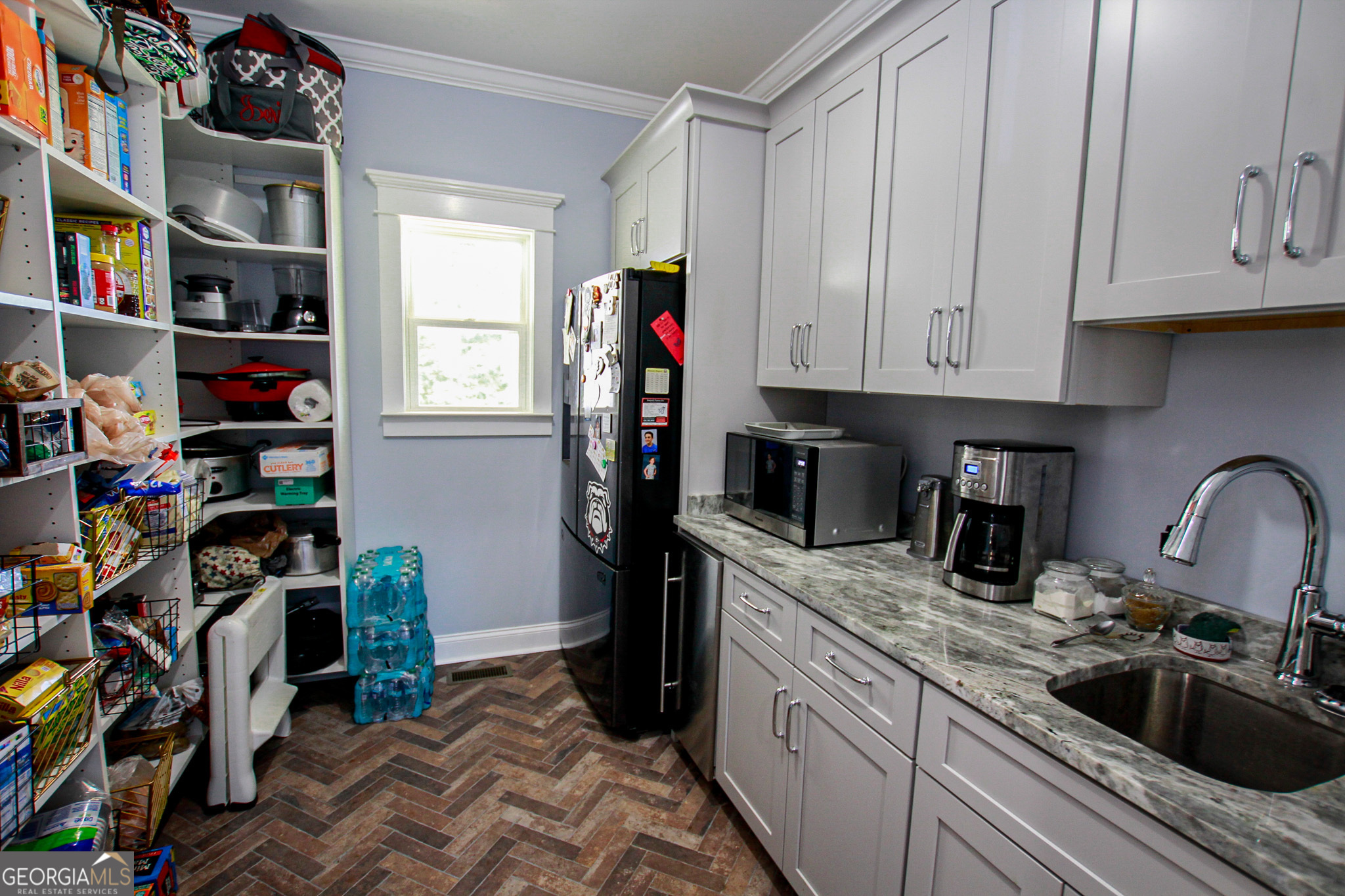 1010 Rock Road Perry, GA 31069 - Photo 18 of 58 a kitchen with stainless steel appliances granite countertop a refrigerator and a sink