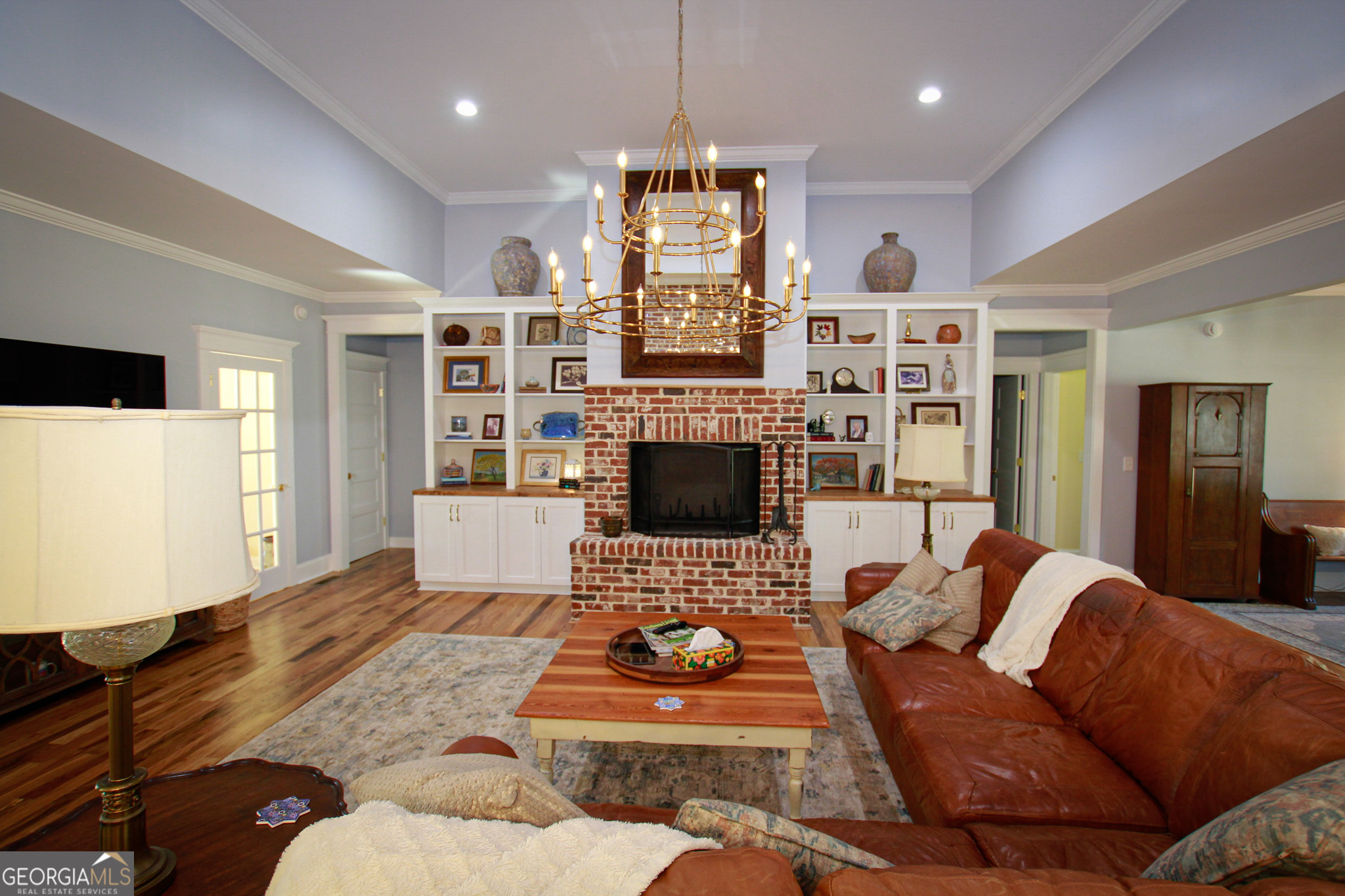 1010 Rock Road Perry, GA 31069 - Photo 19 of 58 a living room with fireplace furniture and a flat screen tv