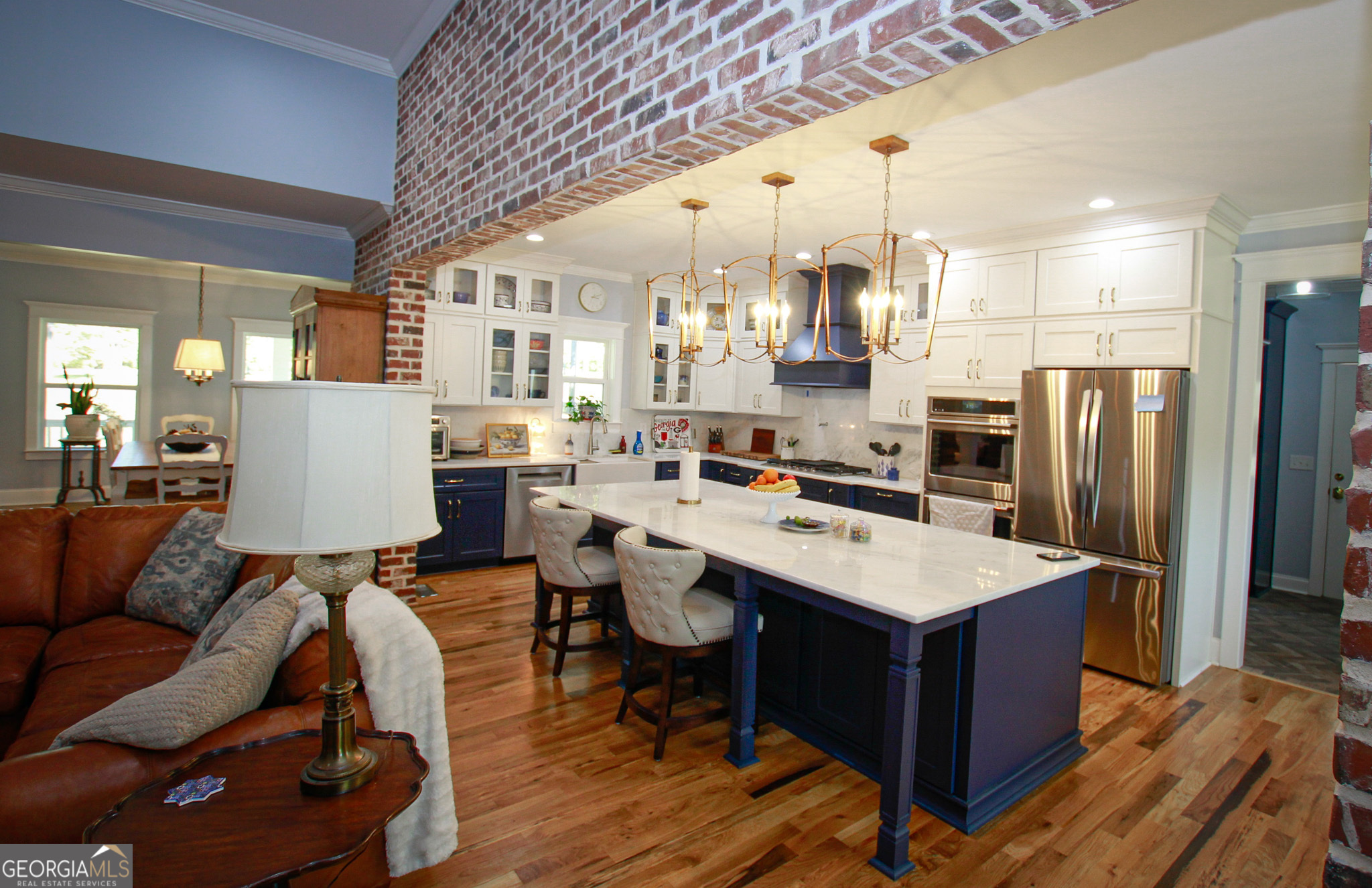 1010 Rock Road Perry, GA 31069 - Photo 24 of 58 a living room with stainless steel appliances kitchen island granite countertop furniture and a kitchen view