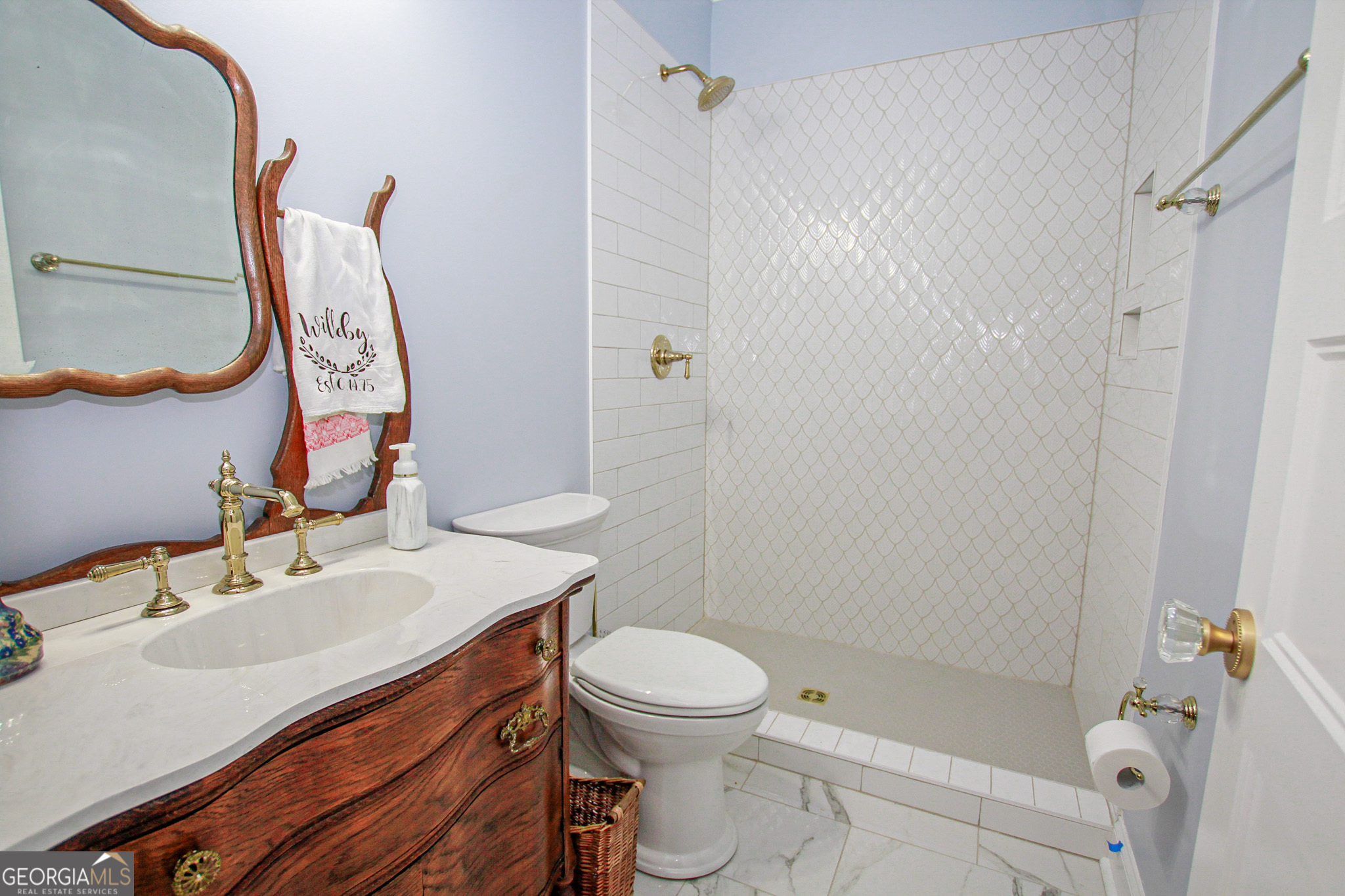 1010 Rock Road Perry, GA 31069 - Photo 29 of 58 a bathroom with a sink toilet and shower