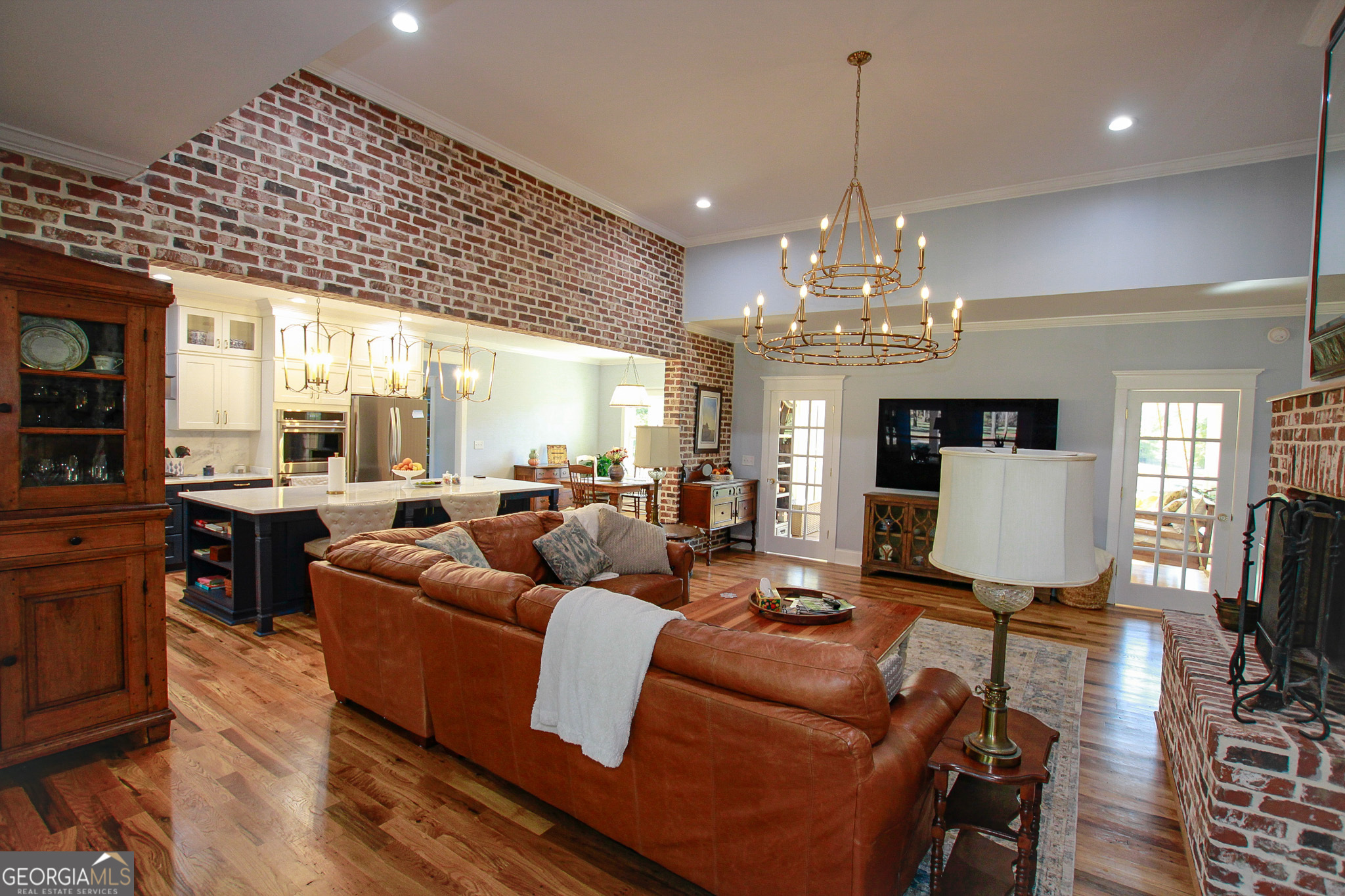 1010 Rock Road Perry, GA 31069 - Photo 3 of 58 a living room with furniture a chandelier and a chandelier