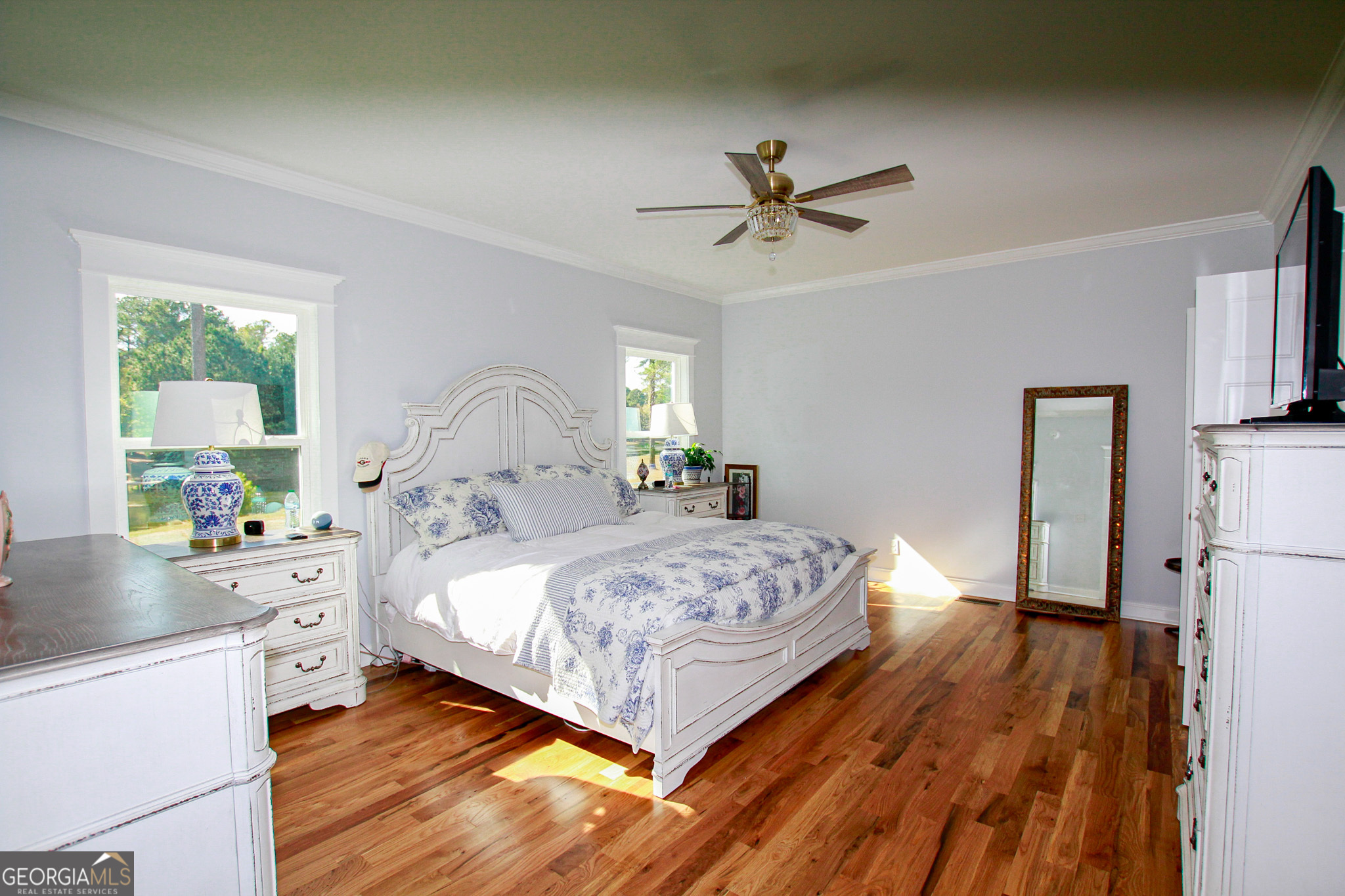 1010 Rock Road Perry, GA 31069 - Photo 32 of 58 a bedroom with a bed and a chandelier