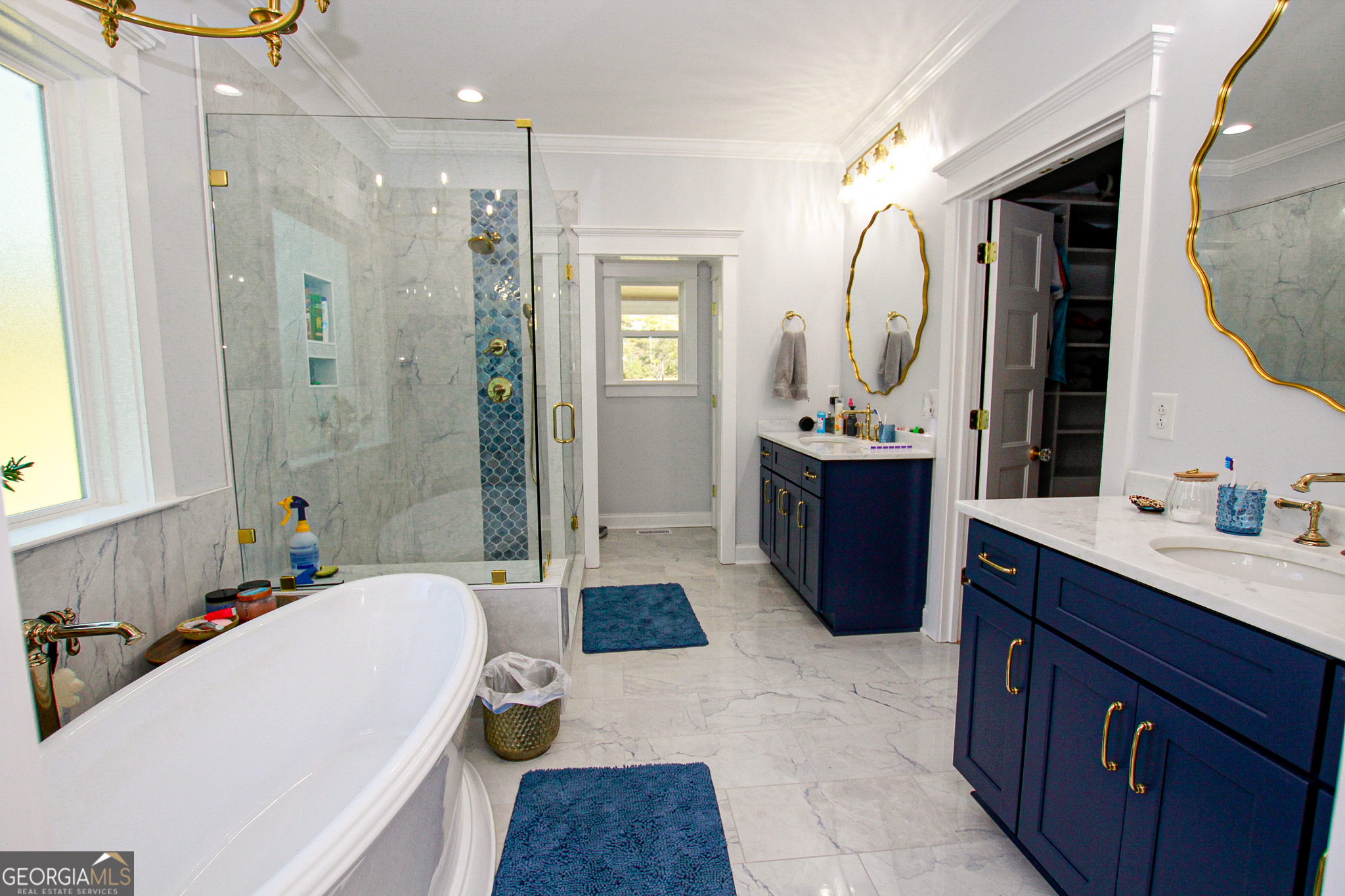 1010 Rock Road Perry, GA 31069 - Photo 34 of 58 a bathroom with a tub sink and mirror