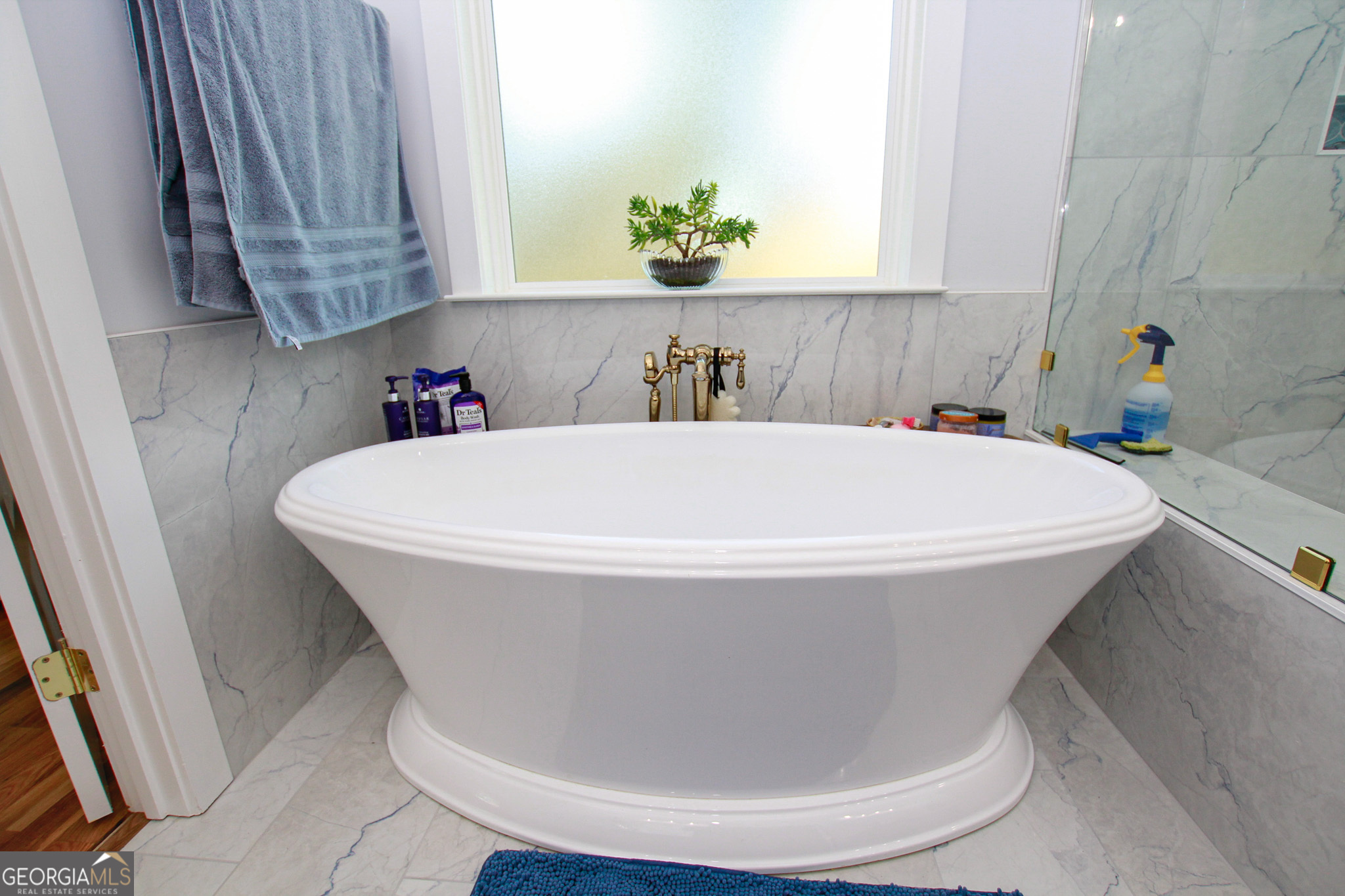 1010 Rock Road Perry, GA 31069 - Photo 35 of 58 a white bath tub sitting in a bathroom