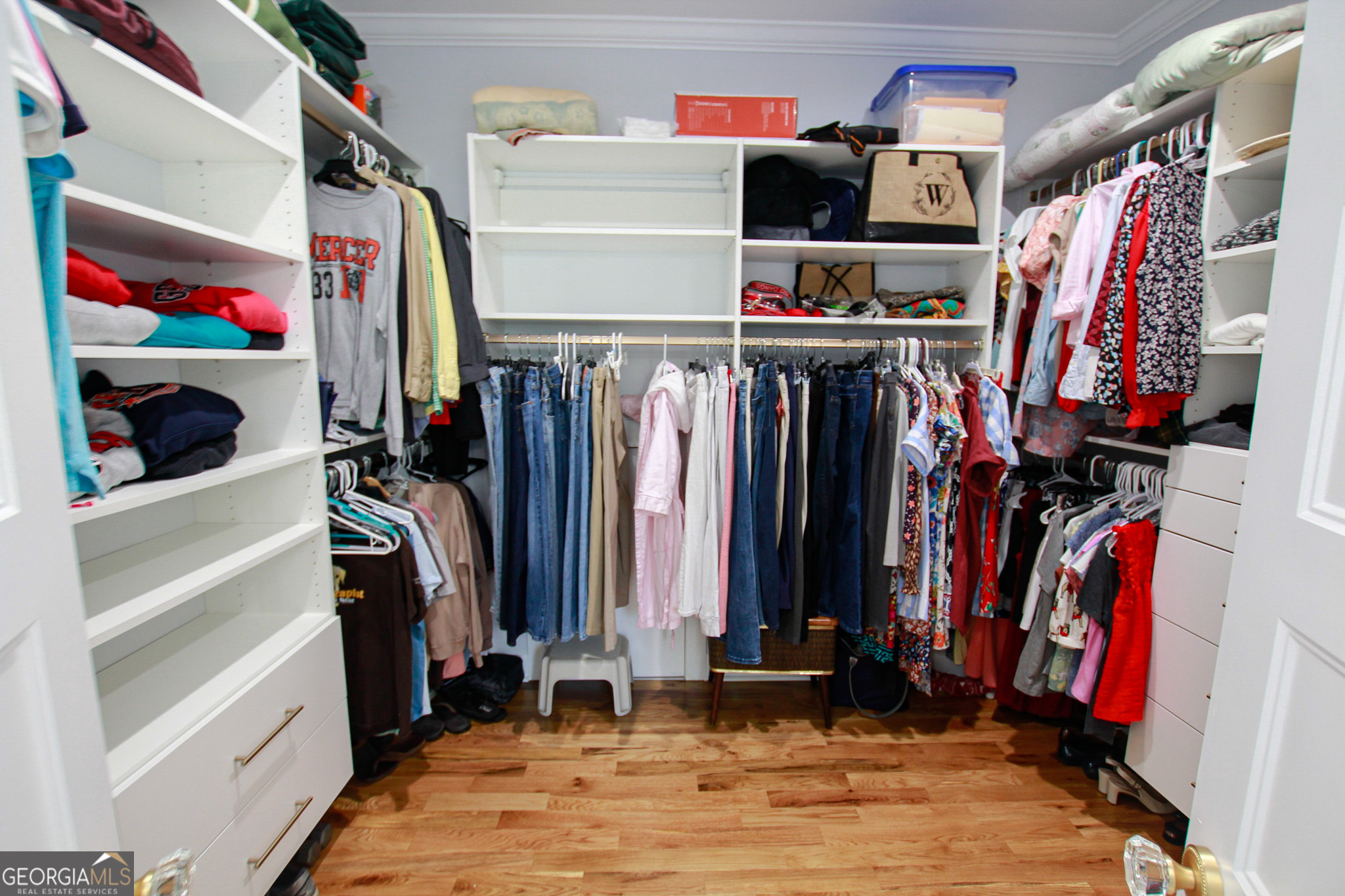 1010 Rock Road Perry, GA 31069 - Photo 38 of 58 a view of walk in closet with clothes and shoes