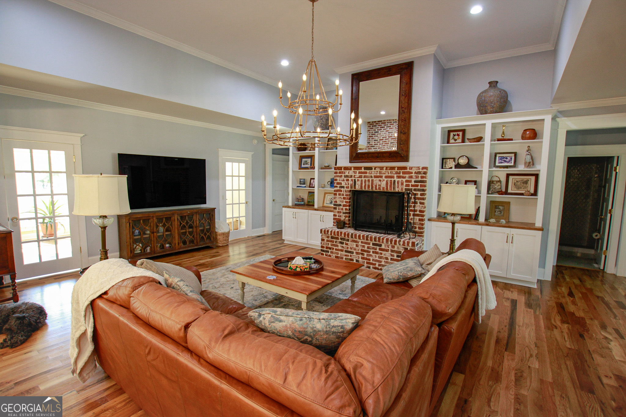 1010 Rock Road Perry, GA 31069 - Photo 4 of 58 a living room with furniture fireplace and flat screen tv