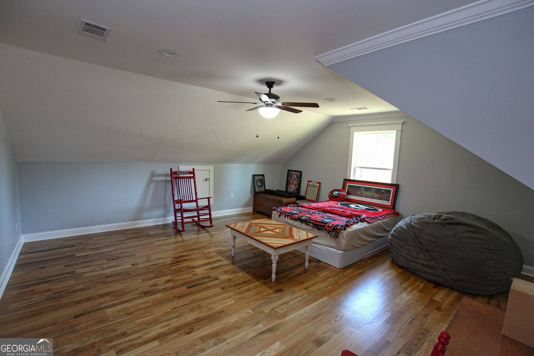 1010 Rock Road Perry, GA 31069 - Photo 45 of 58 a living room with furniture and a chandelier