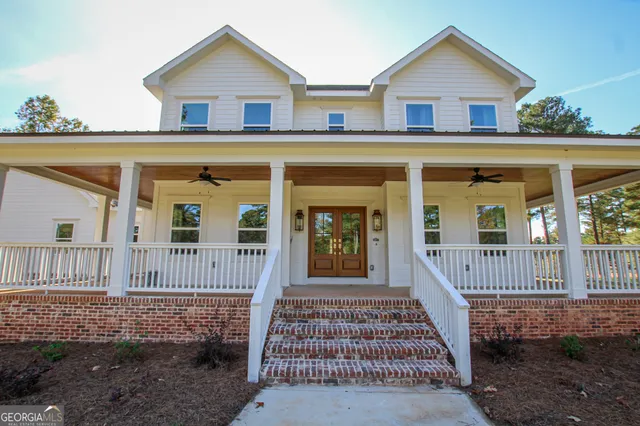 a view of a yard with houses