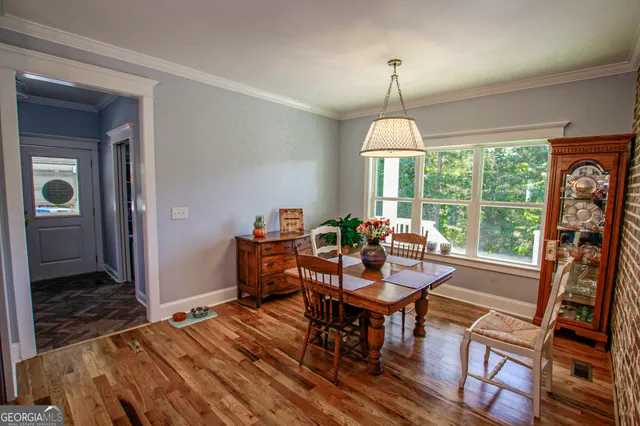 a view of a dining room with furniture window and outside view