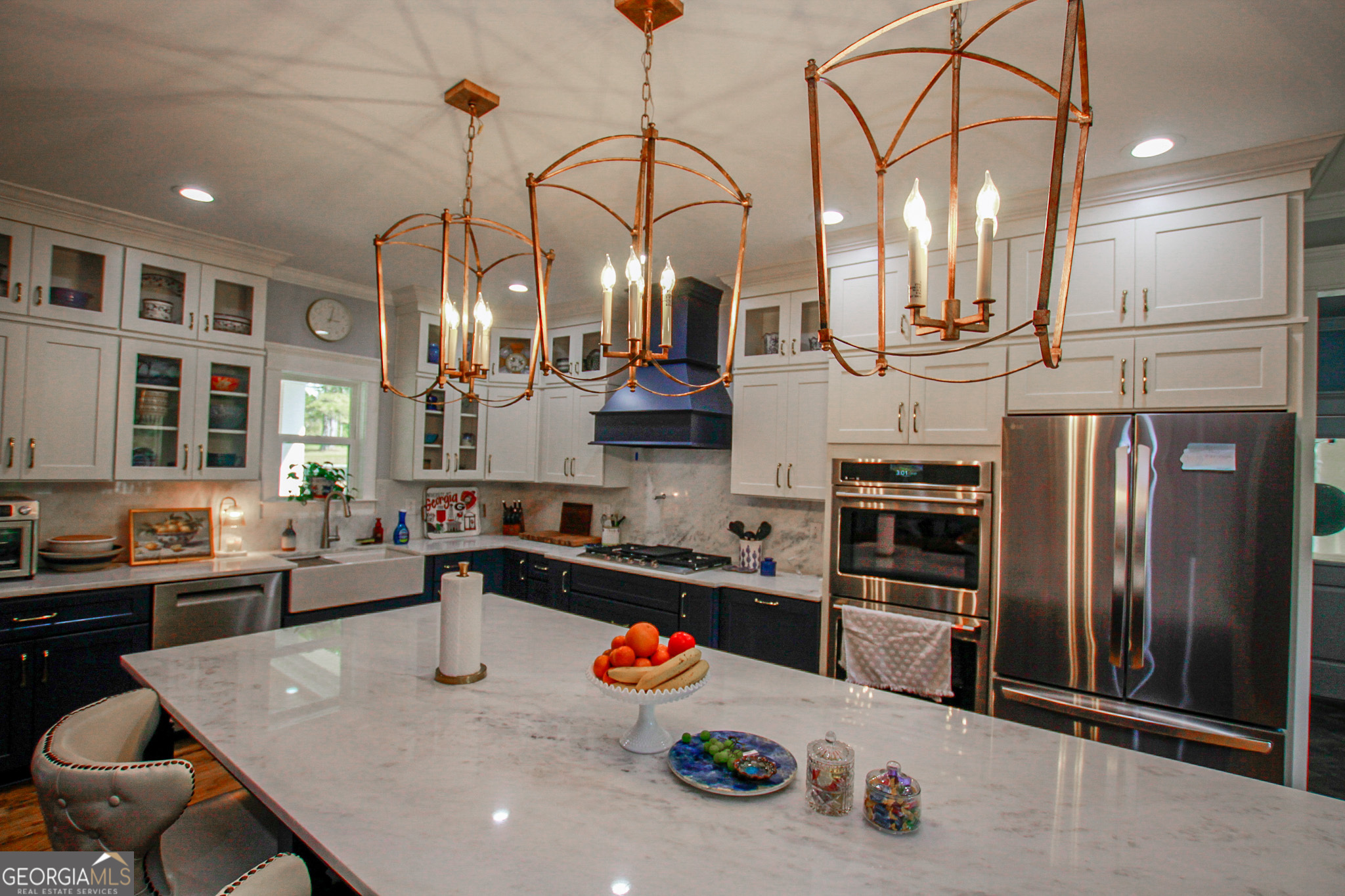 1010 Rock Road Perry, GA 31069 - Photo 10 of 58 a kitchen with stainless steel appliances granite countertop a sink a stove and a refrigerator