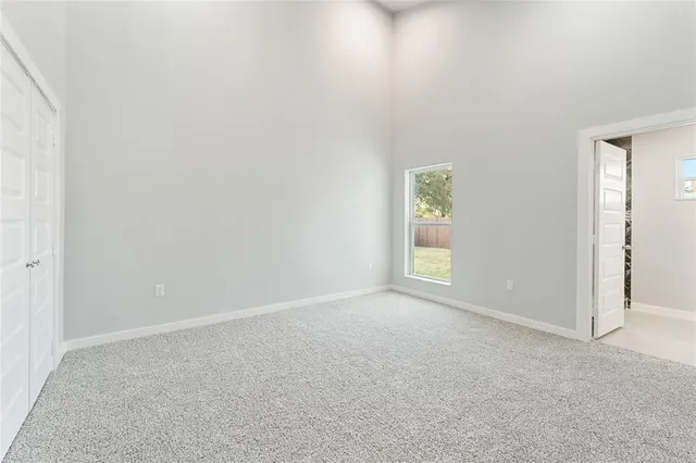 an empty room with windows and windows