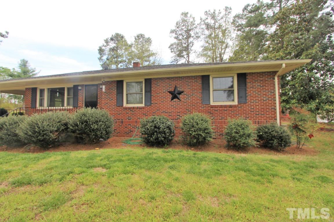 199 Carver Holt Road Roxboro, NC 27574 - Photo 2 of 23 front view of a house with a yard