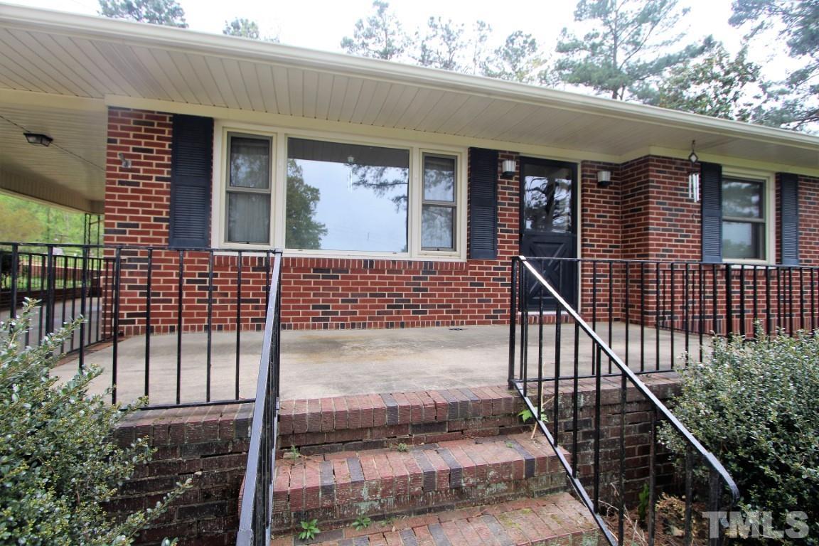 199 Carver Holt Road Roxboro, NC 27574 - Photo 3 of 23 a view of a house with backyard and porch