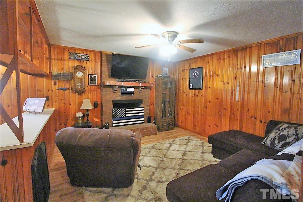 199 Carver Holt Road Roxboro, NC 27574 - Photo 7 of 23 a living room with furniture and a flat screen tv