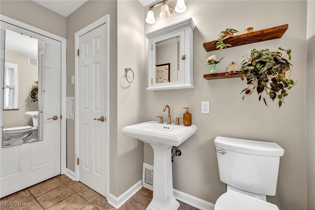 1317 Belrose Road Cleveland, OH 44124 - Photo 18 of 50 Half bathroom featuring toilet and light tile patterned floors
