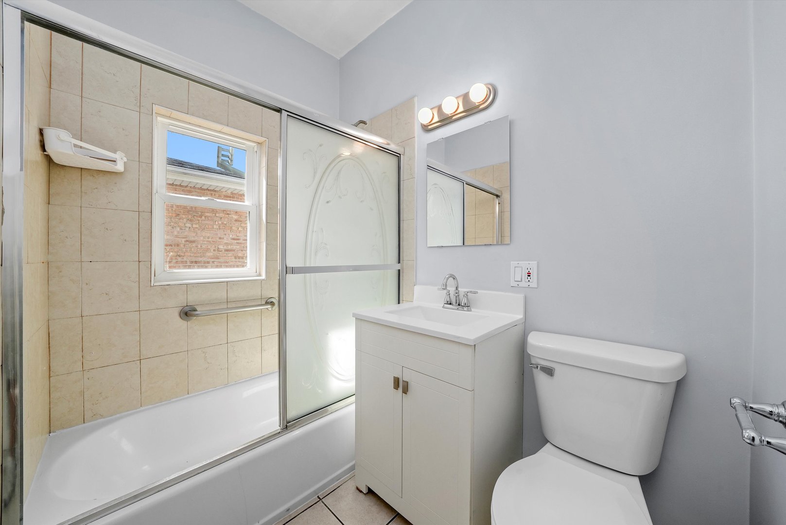 3604 West 65th Place Chicago, IL 60629 - Photo 17 of 27 a bathroom with a toilet sink and shower