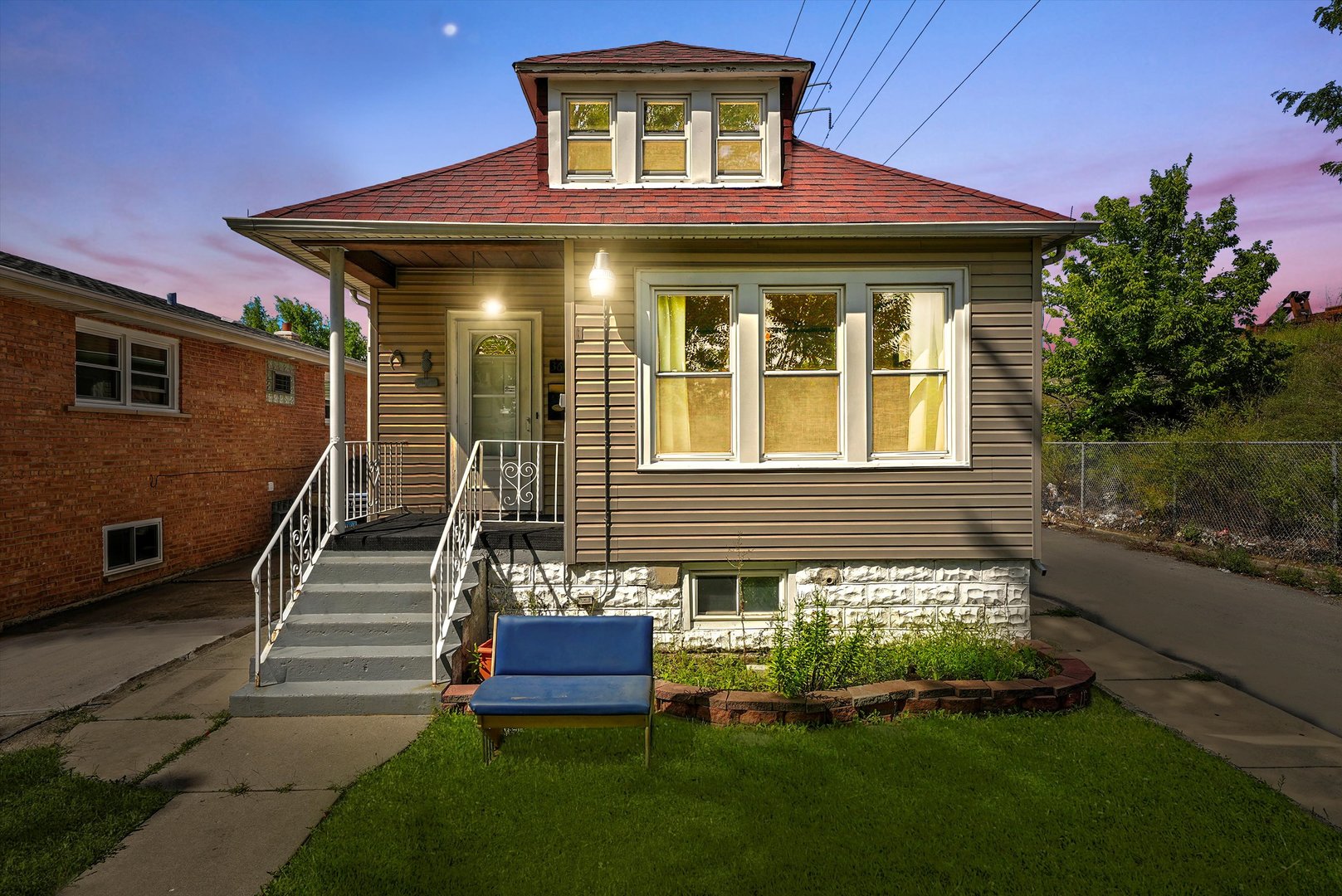 3604 West 65th Place Chicago, IL 60629 - Photo 2 of 27 a front view of a house with a yard