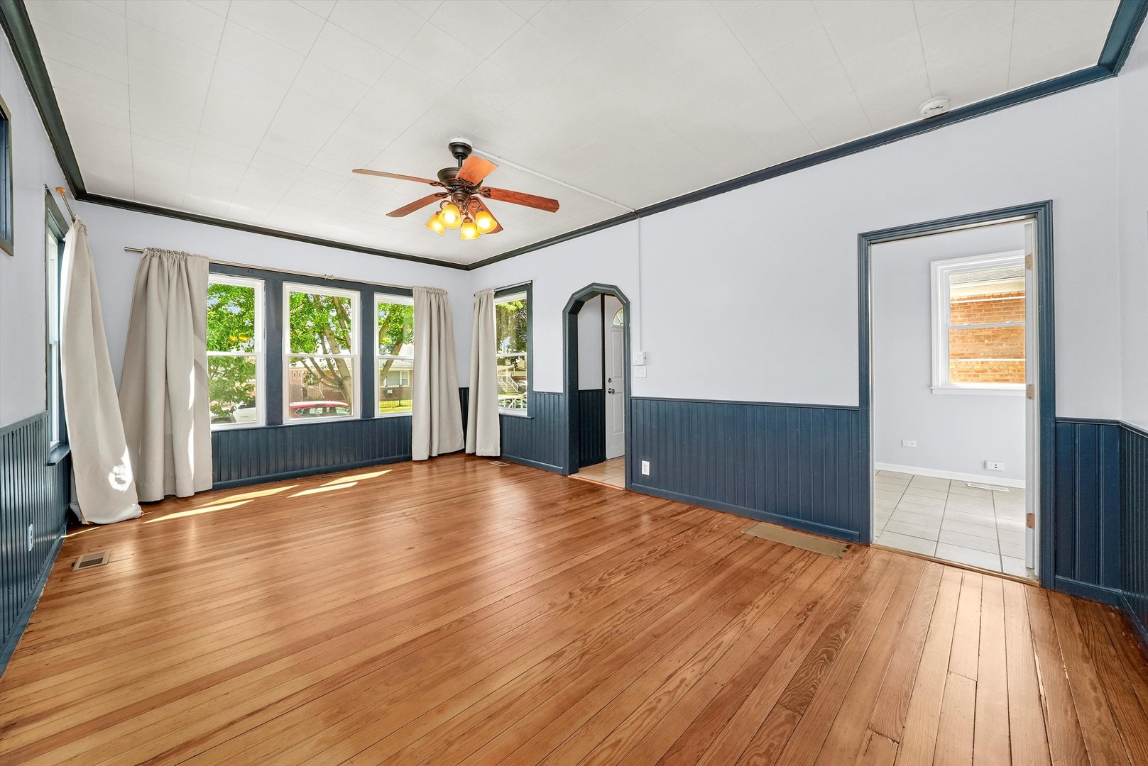 3604 West 65th Place Chicago, IL 60629 - Photo 3 of 27 wooden floor in an empty room with a window