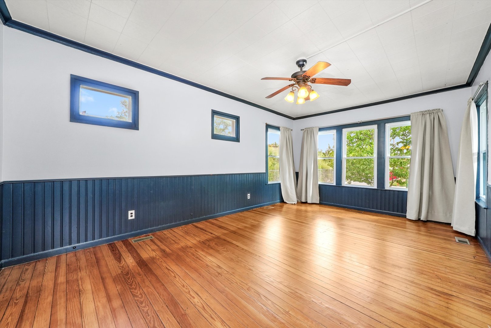 3604 West 65th Place Chicago, IL 60629 - Photo 4 of 27 a view of room with window and wooden floor