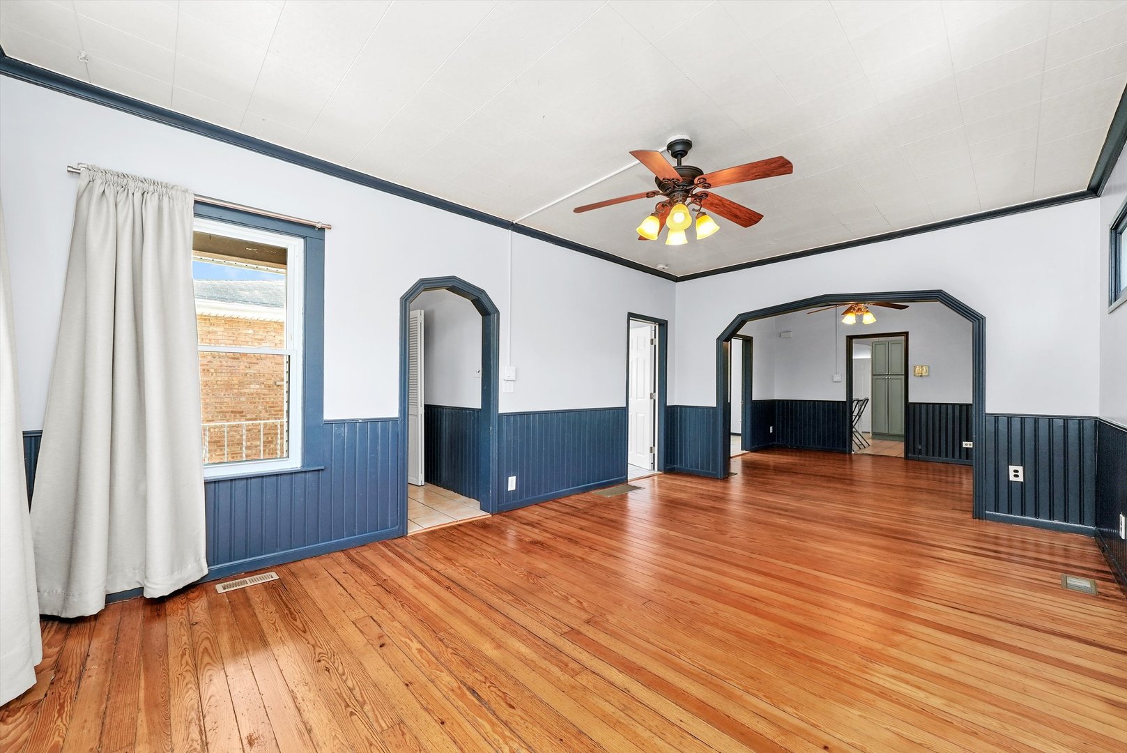 3604 West 65th Place Chicago, IL 60629 - Photo 5 of 27 a view of empty room with wooden floor and fan