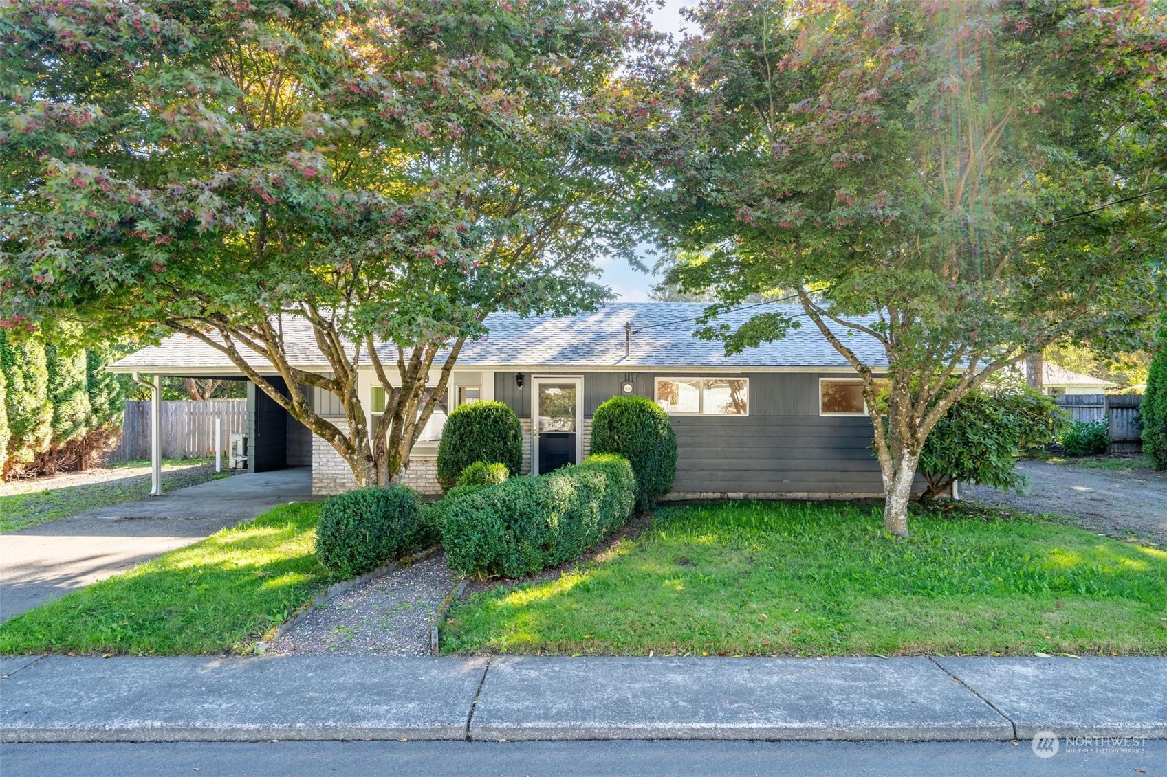 229 V Street Southwest Tumwater, WA 98501 - Photo 1 of 38 a front view of a house with a yard and garage