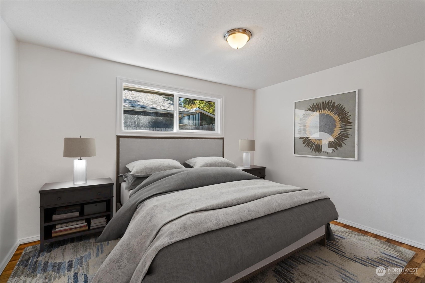 229 V Street Southwest Tumwater, WA 98501 - Photo 14 of 38 a bedroom with a bed and a painting on the wall