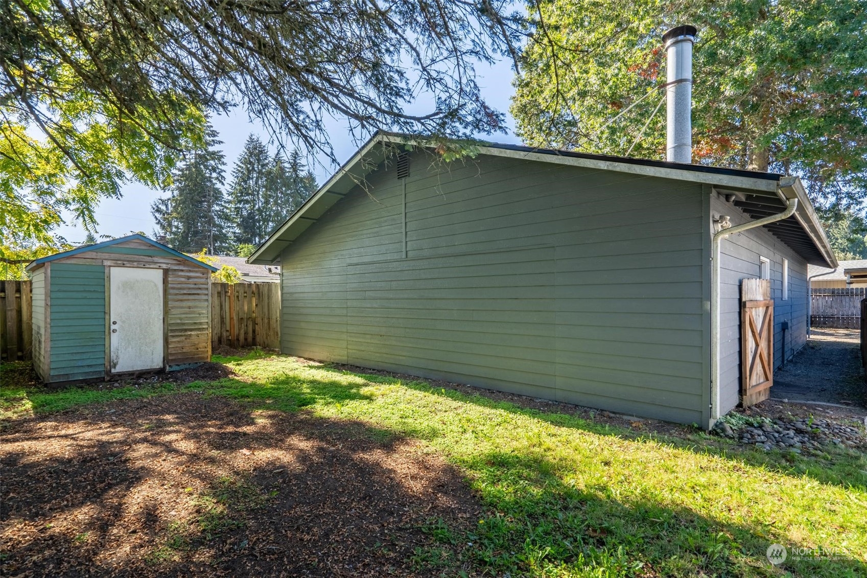 229 V Street Southwest Tumwater, WA 98501 - Photo 21 of 38 a view of a small house with a yard