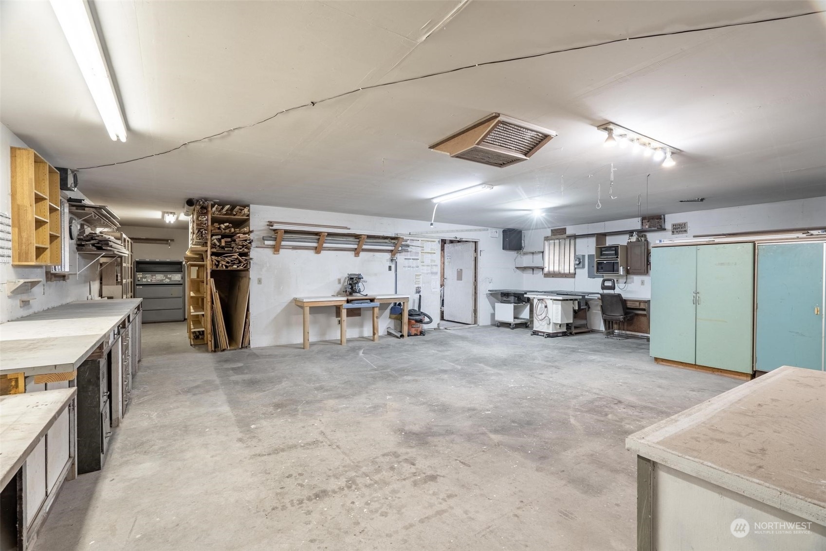 229 V Street Southwest Tumwater, WA 98501 - Photo 24 of 38 a view of a room with lots of wooden furniture and windows