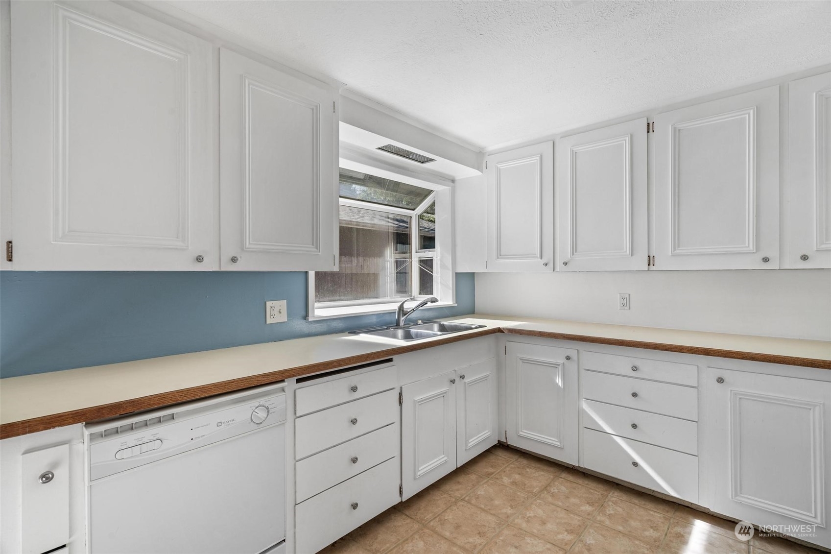 229 V Street Southwest Tumwater, WA 98501 - Photo 7 of 38 a kitchen with white cabinets white appliances and a sink
