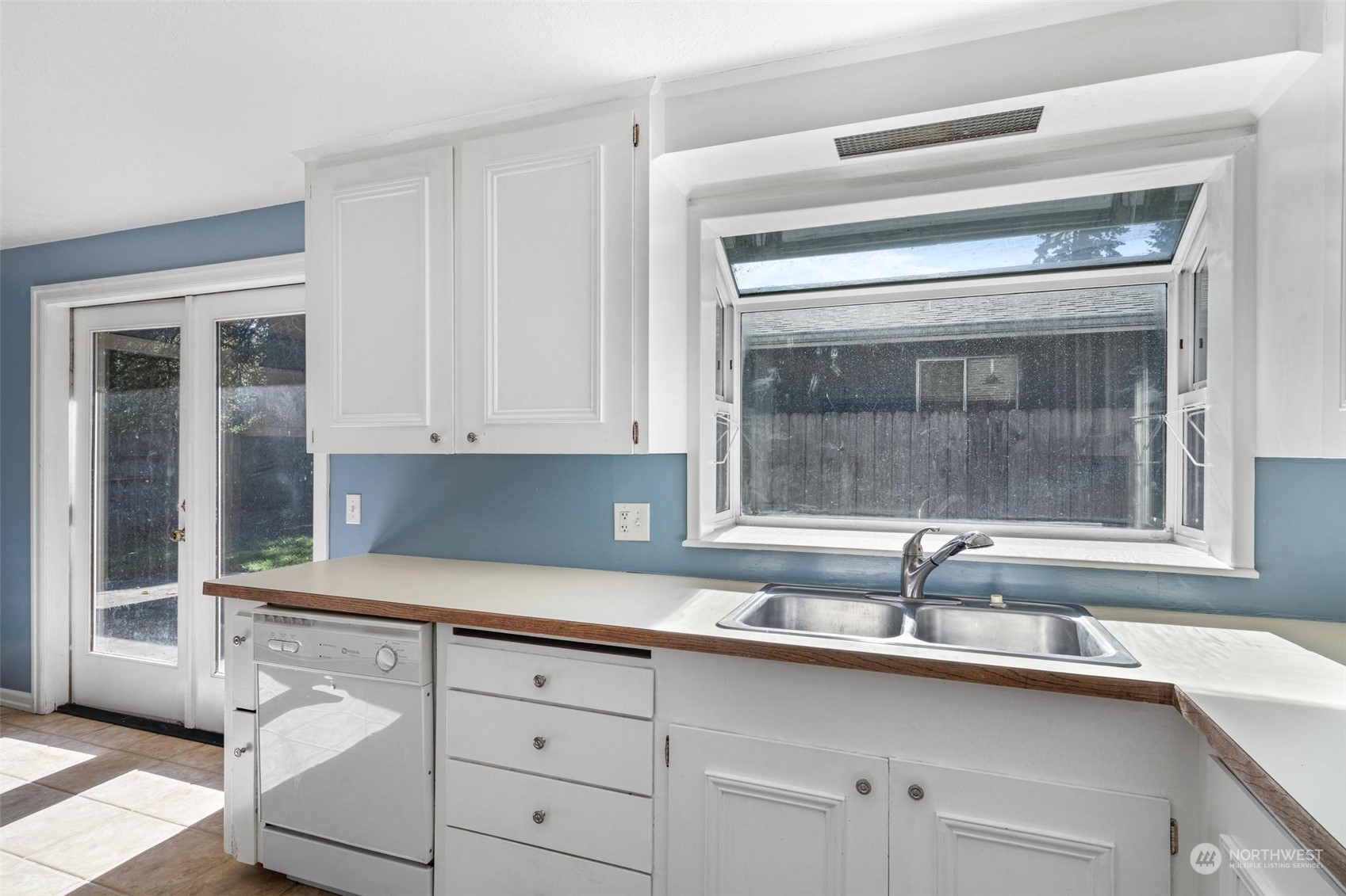 229 V Street Southwest Tumwater, WA 98501 - Photo 8 of 38 a kitchen with a sink and cabinets