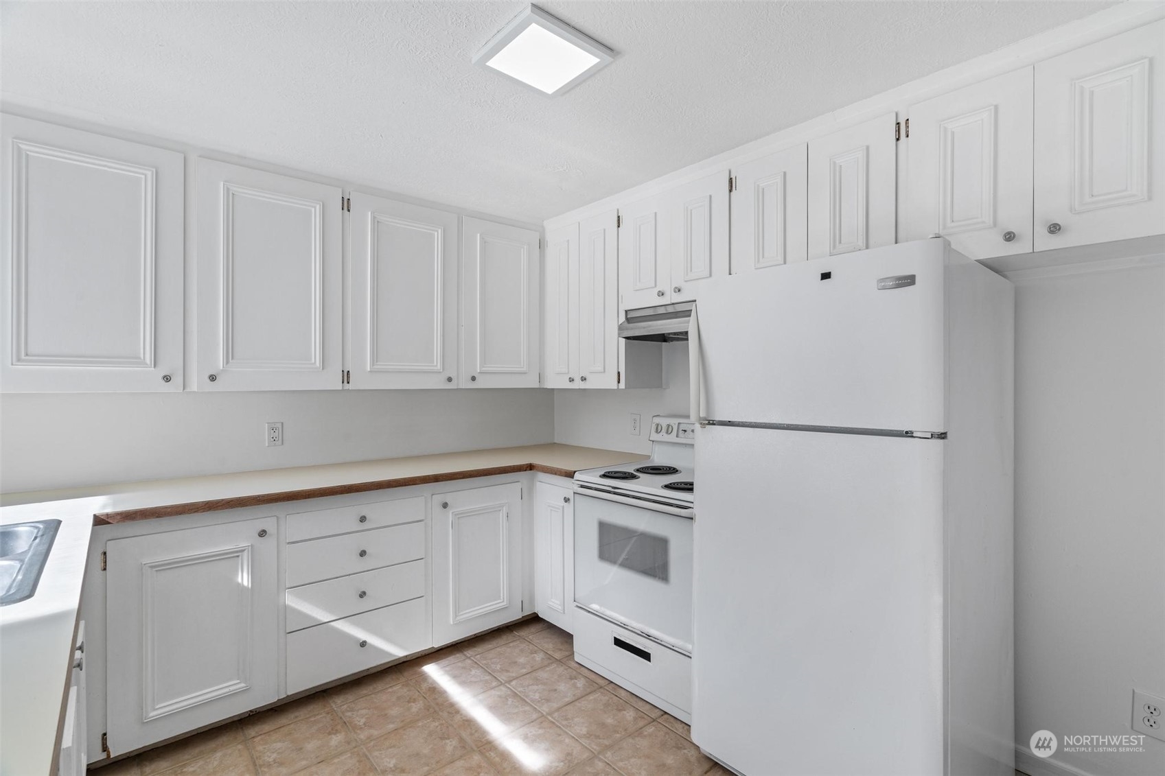 229 V Street Southwest Tumwater, WA 98501 - Photo 9 of 38 a kitchen with white cabinets and white appliances