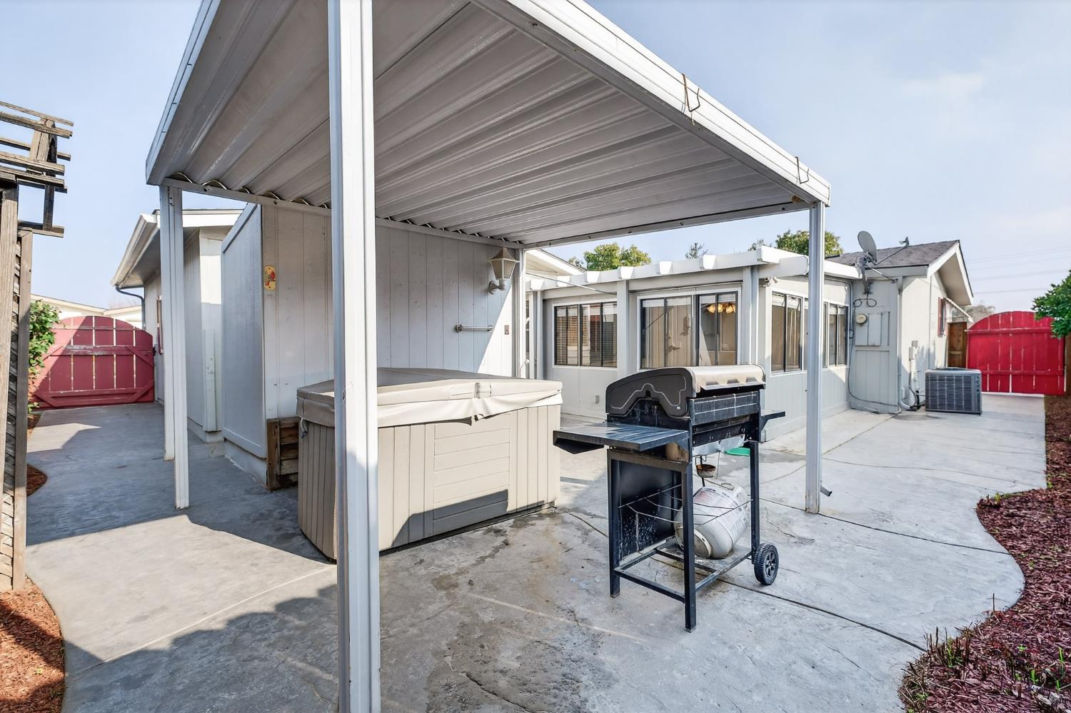 2755 North Walnut Road, Unit 114 Turlock, CA 95382 - Photo 25 of 28 a work space with furniture a rug and a walk in closet