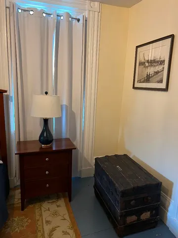a room with a bed and a desk