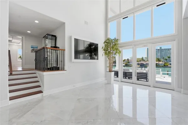 a living room with furniture and flat screen tv