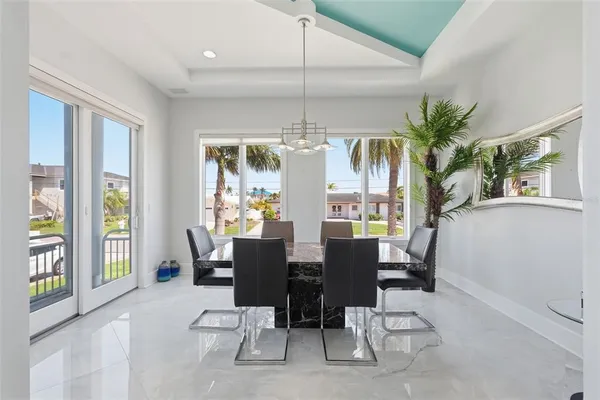 a spacious bedroom with a bed and a ceiling fan