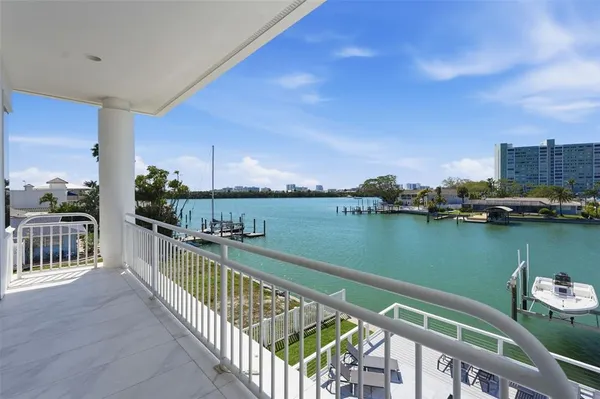 a swimming pool with outdoor seating and city view