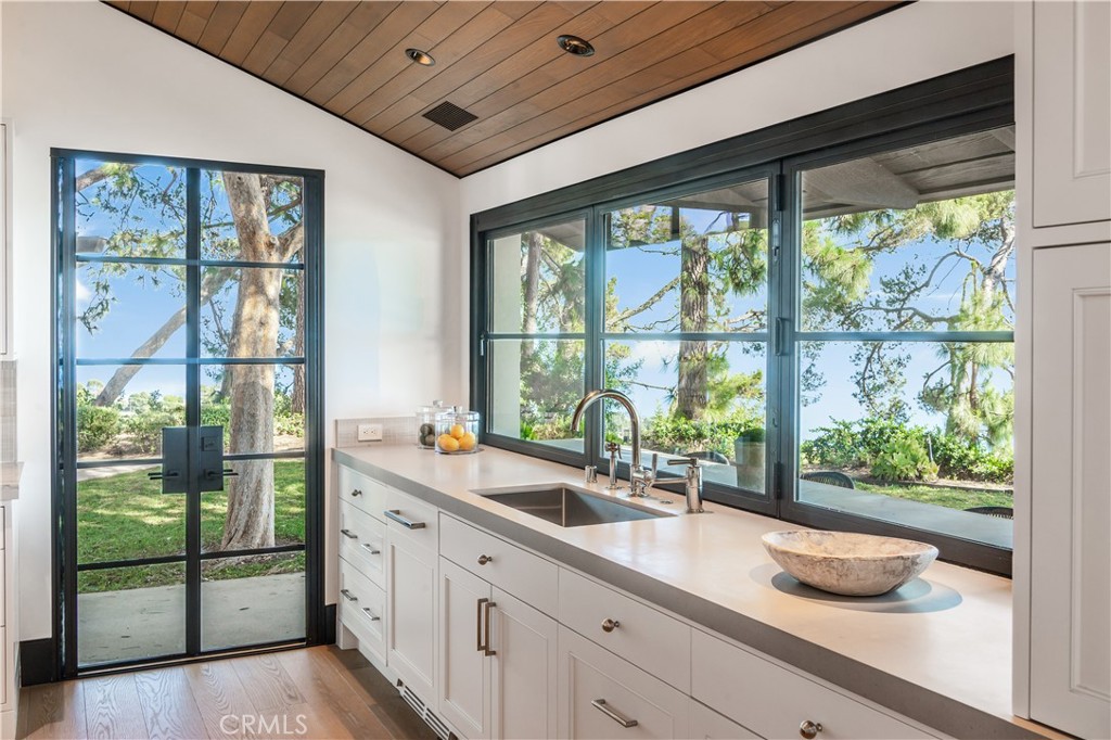 71 Crest Road East Rolling Hills, CA 90274 - Photo 20 of 23 a kitchen with a sink and large window