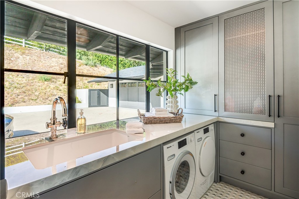 71 Crest Road East Rolling Hills, CA 90274 - Photo 21 of 23 a view of a sink and washer and dryer