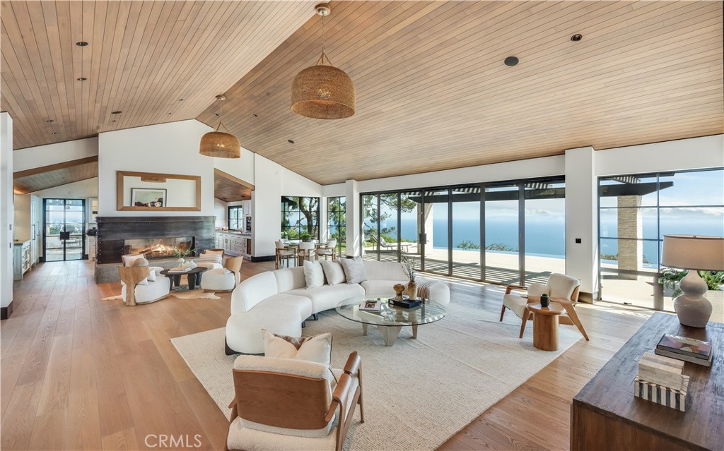 71 Crest Road East Rolling Hills, CA 90274 - Photo 3 of 23 a living room with furniture and a large window