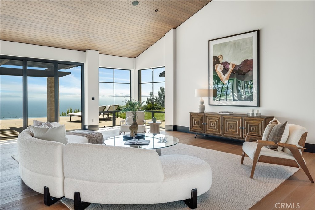 71 Crest Road East Rolling Hills, CA 90274 - Photo 5 of 23 a living room with furniture and a large window