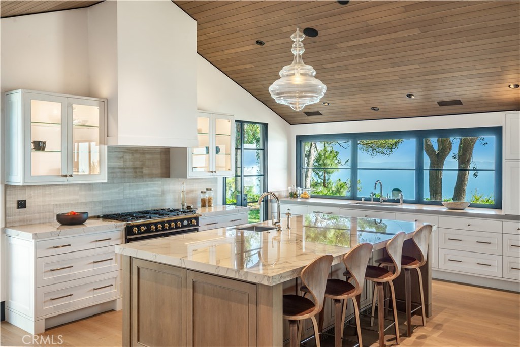 71 Crest Road East Rolling Hills, CA 90274 - Photo 6 of 23 a kitchen with stainless steel appliances granite countertop a stove and cabinets