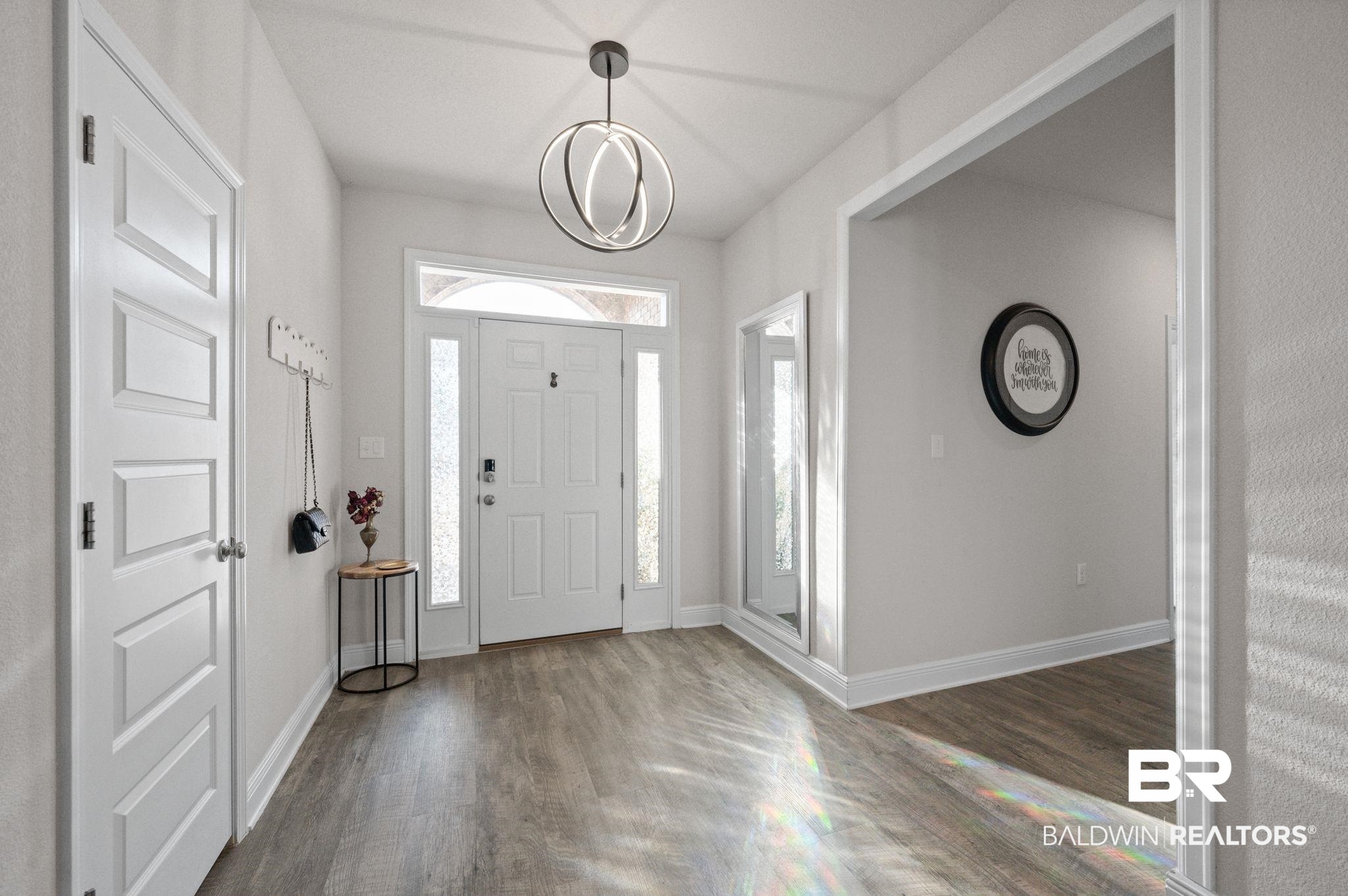 24891 Spectacular Bid Loop Daphne, AL 36526 - Photo 13 of 51 Entryway featuring hardwood / wood-style flooring and a notable chandelier