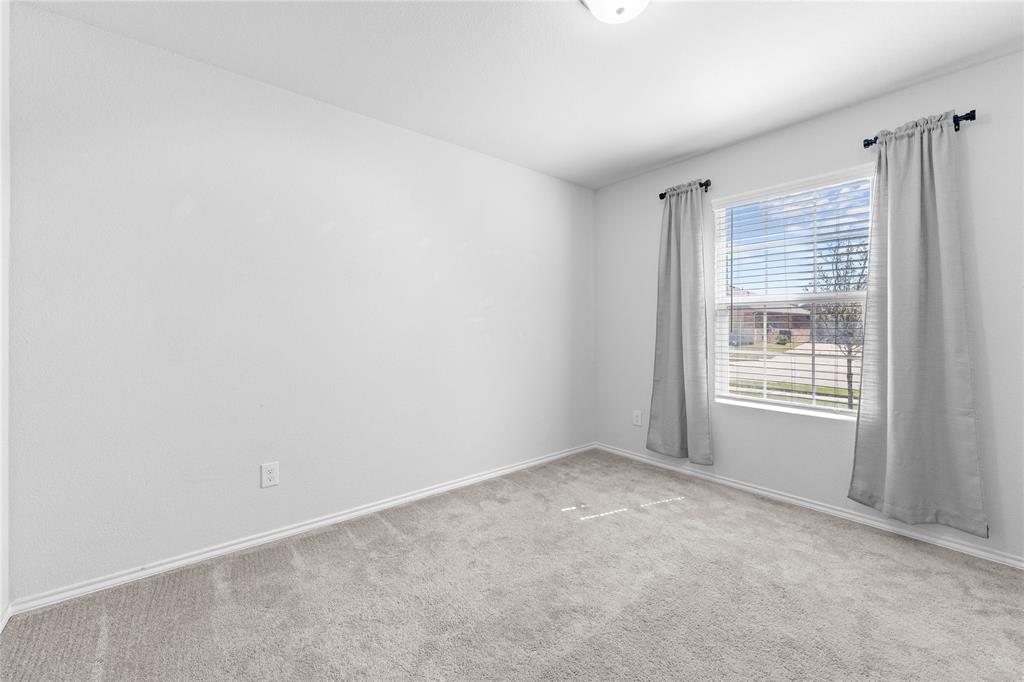 4432 Sagecroft Road Fort Worth, TX 76036 - Photo 10 of 16 Carpeted empty room featuring baseboards